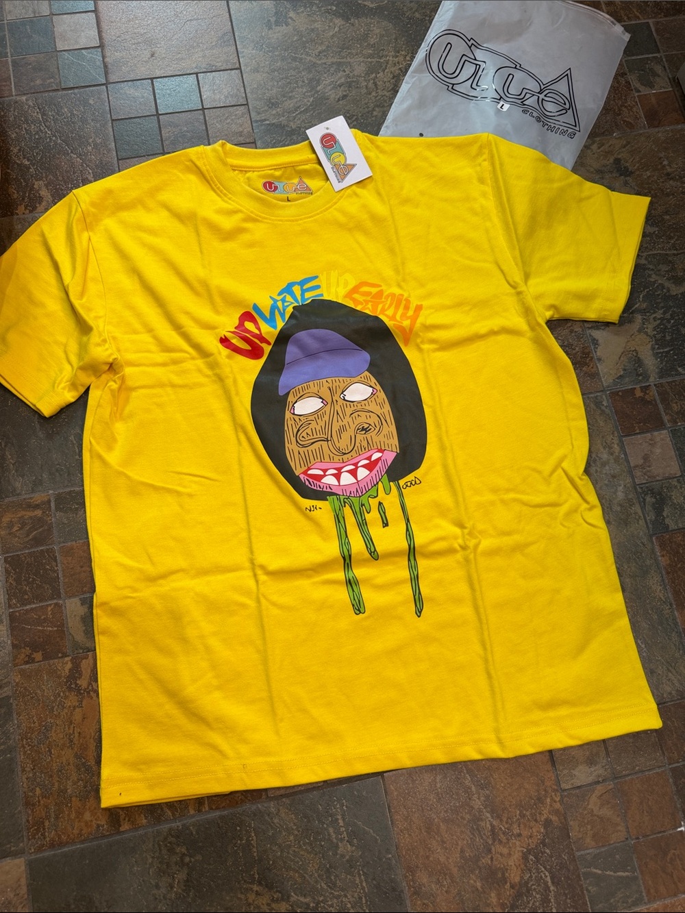 ULUE “Up Late Up Early” Yellow Graphic Tee with Drip Face Art